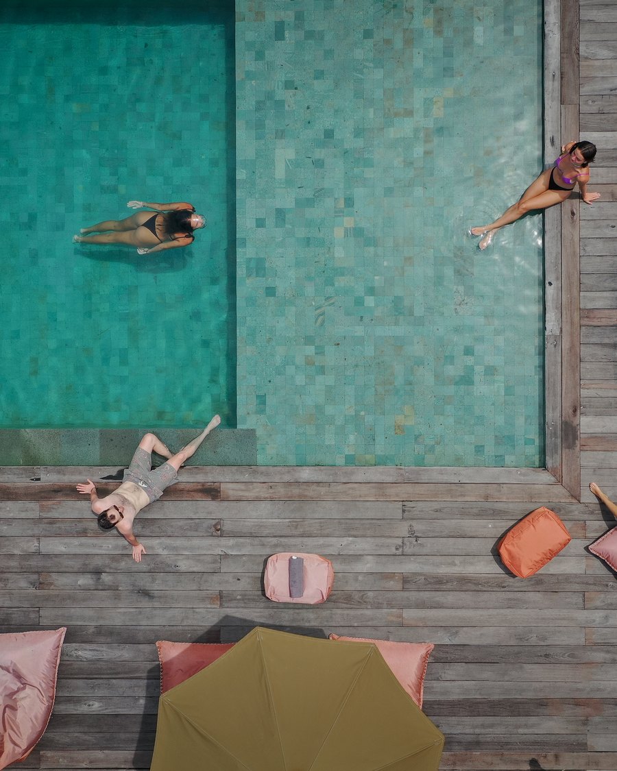 friends floating in the pool, seen from above