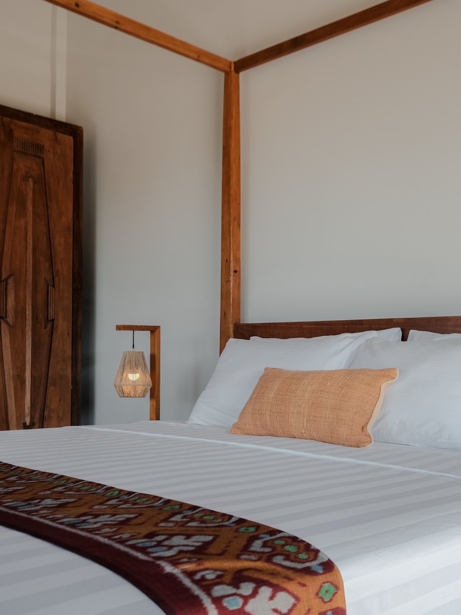 a bed with a woven runner