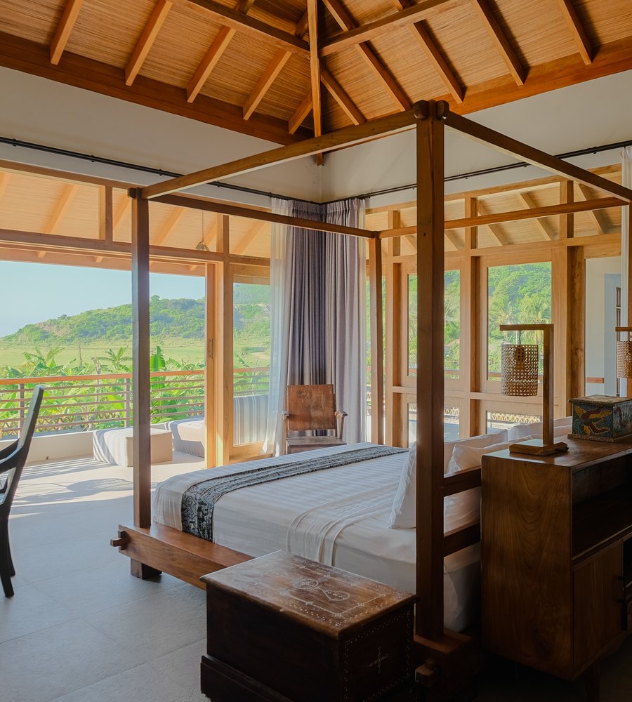 a bedroom that opens to the view